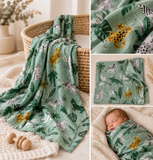 Jungle and safari print muslin with cream background and newborn wrapped in bamboo baby wrap 