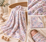 A collage showing a soft floral baby blanket draped over a woven basket, folded, and wrapped around a sleeping baby. The blanket has a pastel pink, lavender, and blue floral print with a cream scalloped edge.