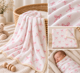Pink muslin baby wrap with cotton lace and is reversible. 